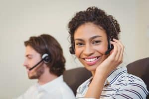 Image of two call center agents providing answering service in Massachusetts