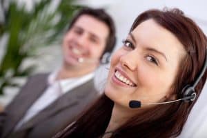 Image of two call center agents providing answering service in West Virginia