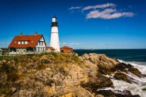 Image of a lighthouse and shoreline in Maine