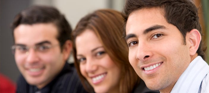 Image of three professionals who use answering service for small business