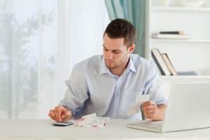Image of a man bookkeeping as a home-based business