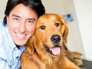 image of a man who just finished grooming a dog from his home-based business