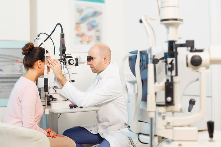 image of a patient receiving an examination from an eye care professional who uses an eye doctor answering service