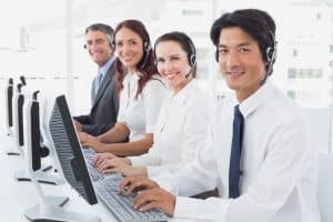 Image of four MAP Communications call center agents providing answering services