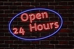 Image of a sign that says Open 24 Hours at a 24 hour call answering service