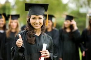 Image of college students graduating from a university that uses an education answering service