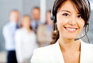 Image of call center agents handling phone calls for telecom businesses