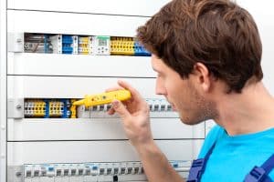 Image of an electrician checking voltage